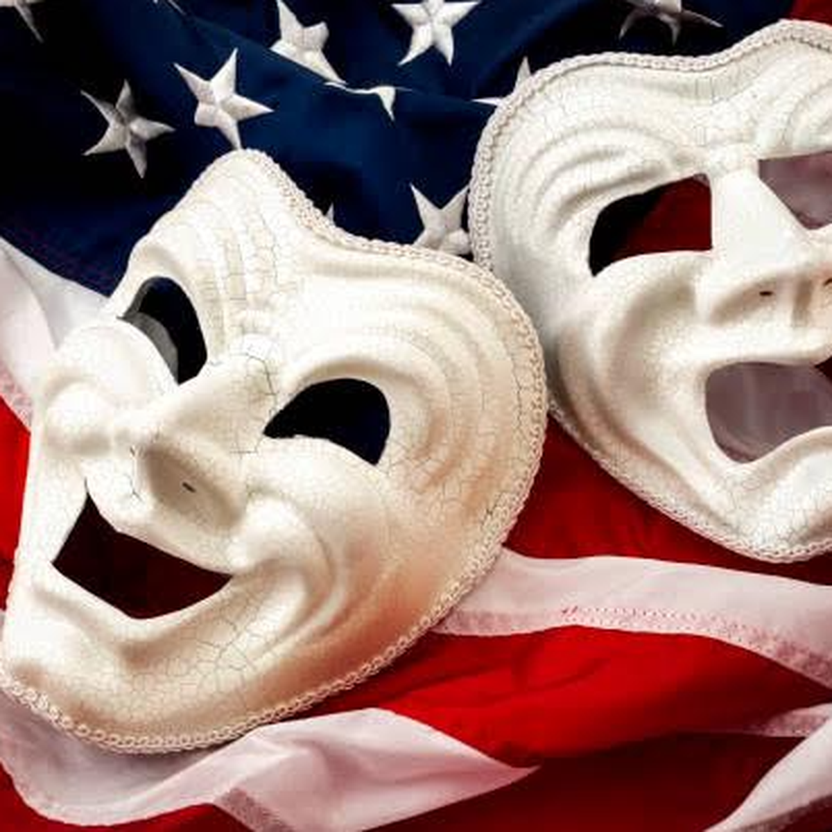 Comedy and tragedy masks on an American flag
